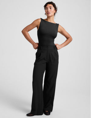 black mid rise jetstretch woven pants with cargo style pockets. 