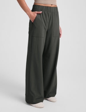 A person wears the dark olive Easy Wide Leg Pant 31