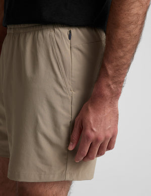 Side detail of beige Pivotal 2.0 Men's Short 7
