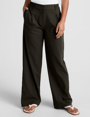 Olive green Status Wide Leg Trouser featuring a pleated front, elastic waistband, side pockets, and a flowy, wide-leg cut.