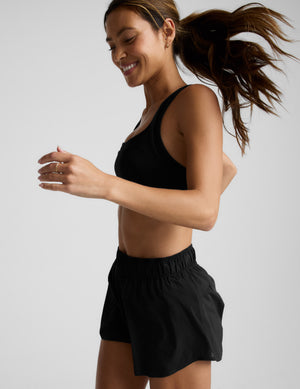Woman running in black Solemate 2.5