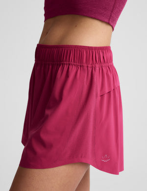 Side profile of a person wearing fuchsia Solemate 2.5