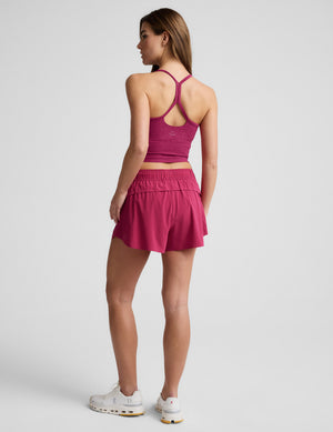 Back view of a woman wearing fuchsia Solemate 2.5
