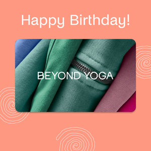 Happy Birthday message with 'Beyond Yoga' branding on a pink background with fabric texture.